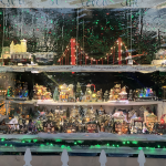 Magical village scene with trains, ski lift and carnival rides