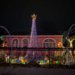 Street view of house with 14 foot light tree. Multicolor.